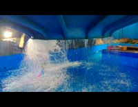 Guy falls upside down from swimming slide