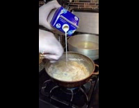 Guy shows how to cook bechamel pasta 