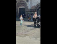 Two women tiktok dance inside Disneyland