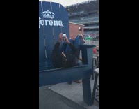 Guy large blue chair feet stadium