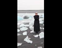 Collab IITW - Woman black outfit poses beside ice blocks