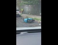 Blue motorcycle lying down on street radio