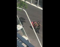 Guy pushes shopping cart with loud speaker preaching 