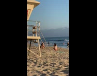 Girl fixes white bikini lifeguard tower beach 