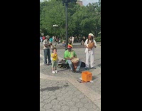 Little boy plays kazoo with jazz band 