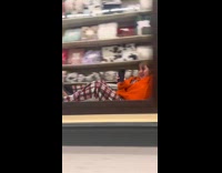 Woman films herself being dragged across store aisle