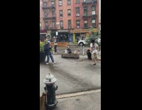 Woman striped vest dance street fire hydrant