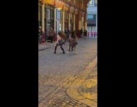 Two women in skirt tiktok dance at the alleyway