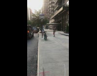 Leopard bodysuit person walks sidewalk black car 
