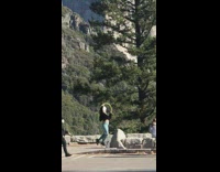 Woman Ushanka blue pants yellow hula-hoop park