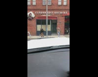 Woman scarf sweater raise hand street brewing