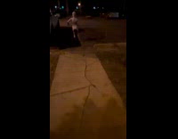 Kid in scary costume dancing in parking lot 