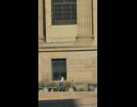 Woman in white top tiktok dance outside museum