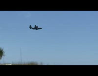 Woman plays guitar and then an airplane flew nearby