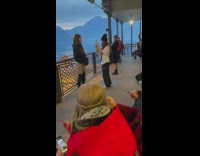 Girl boots jacket pose on lake boat ride