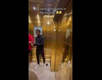 Guys doing fart spray prank in elevator 