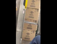 Piles of boxes of clorox urine remover on subway train