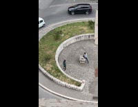 Man green jacket tiktok dance road middle