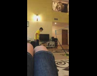 Rich kids play badminton net inside mansion