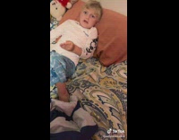 Son gets up to flex when mom says someone wants to fight her