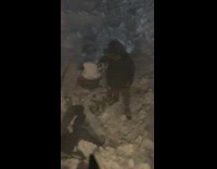 Guy uses dust pan to scoop snow