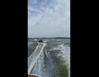 Guy scorpions while wakeboarding