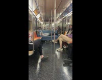 Guy lays on couch in middle of subway 