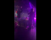 Women animal body paint dances inside club