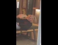 Girl lay on chair pour icing mouth