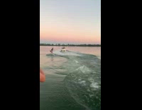 Guy on wakeboard gets pulled off high platform by boat into the water
