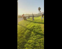 Man DJ music dance public park video shoot