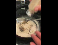 Woman mother uses flour to make homemade gravy 