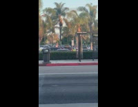 Pink dress girl dances full parking lot 