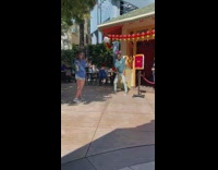 Man with headband tiktok dance at the park