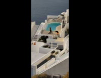 Woman in black dress danced on the balcony