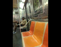 Man with scooter motorcycle inside the train