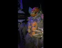 Man wearing Halloween costume laughs funny 