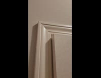 Carpenter shows tools needed to fix door 