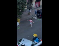 Man spread arms timer photo on street