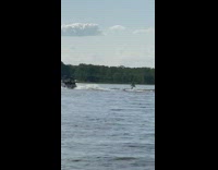 Man toga graduation surfboard ocean yacht