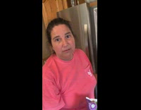 Woman in front of fridge asked what she does during quarantine 