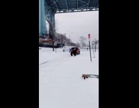 Car pulls guys on snowboard bridge snow 