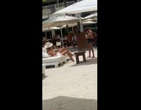 Woman white hat sit chair sunshade umbrella