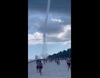 Submitter shows huge water spout near beach