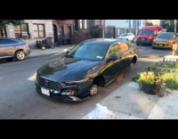 Collab WINY - Car with stolen tires on the street