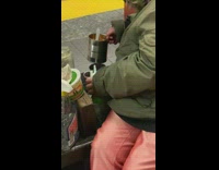 Woman cook while wait on the train in subway NY 
