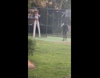Woman wears a long and tall stilt at the park
