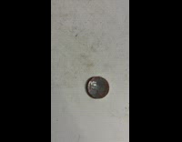 Girl shows penny coin is silver underneath