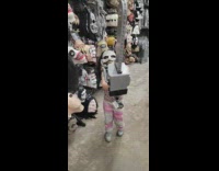 Little girl with halloween mask with chainsaw 