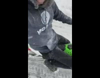 Biker pulls guy on skis